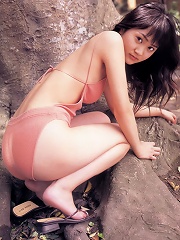 Adorably sweet asian beauty is terribly cute in a pink swim suit
